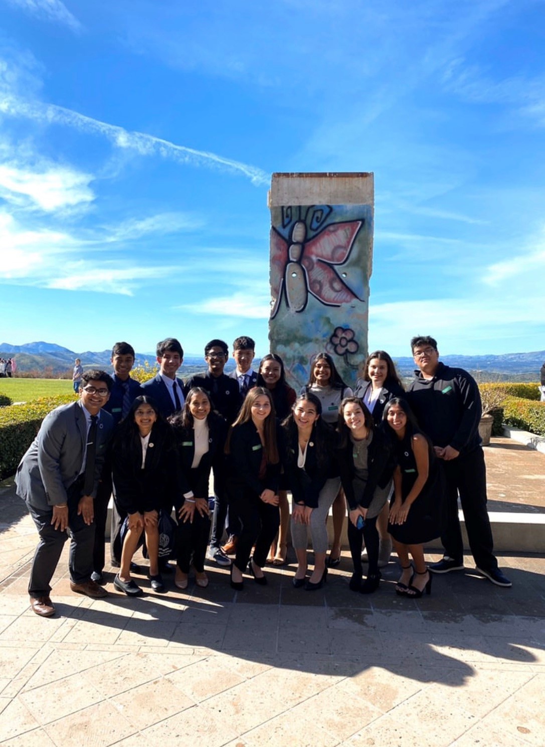 Youth Council standing in front of the Berlin Wall monument at the Ronald Reagan Presidential Library and Museum