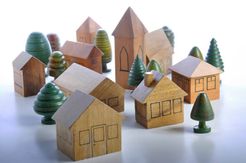 miniature wooden toy model homes and trees